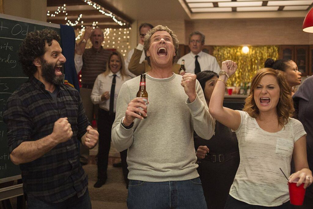 Three people celebrating with drinks