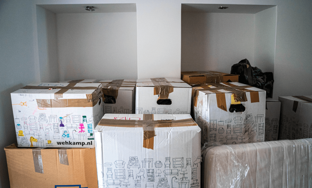 Cardboard moving boxes filling a room.
